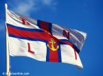 ID 1071 R.N.L.I. (Royal National Lifeboat Institution) flag flying at the Calshot Castle station, Hampshire, England.